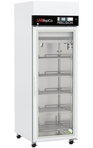 A LabRepCo labeled PRECISION Series 23 Cu. Ft. Laboratory Refrigerator with Touchscreen Controller at the top of the unit and closed Glass Door. Also showing locking casters
