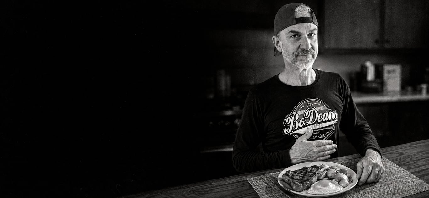 Todd Jones sitting at a table with a meal.