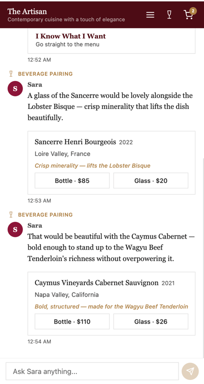 The Cordiant for Restaurants surface for The Artisan — burgundy header with the restaurant's name and tagline, a hero photograph of a plated salmon with quinoa, asparagus, and edible flowers, and Sara greeting a returning guest by name with anniversary recognition: Good evening, Alexandra. Welcome back to The Artisan — and happy anniversary. Below: three quick options — Guide Me Through the Evening, Start with Wine, I Know What I Want.