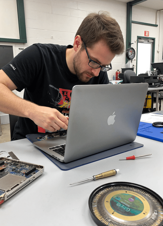 MacBook battery replacement service in Thane with technician