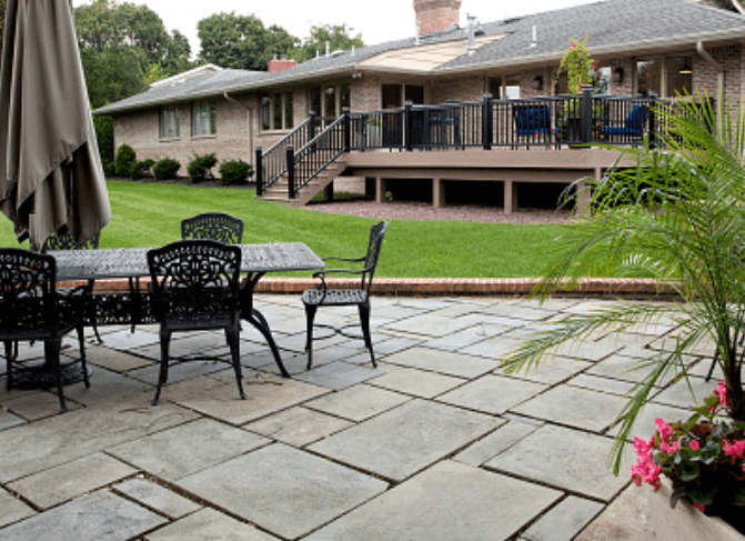 Decorative stamped concrete patio installation in Suffolk Virginia with custom slate pattern design