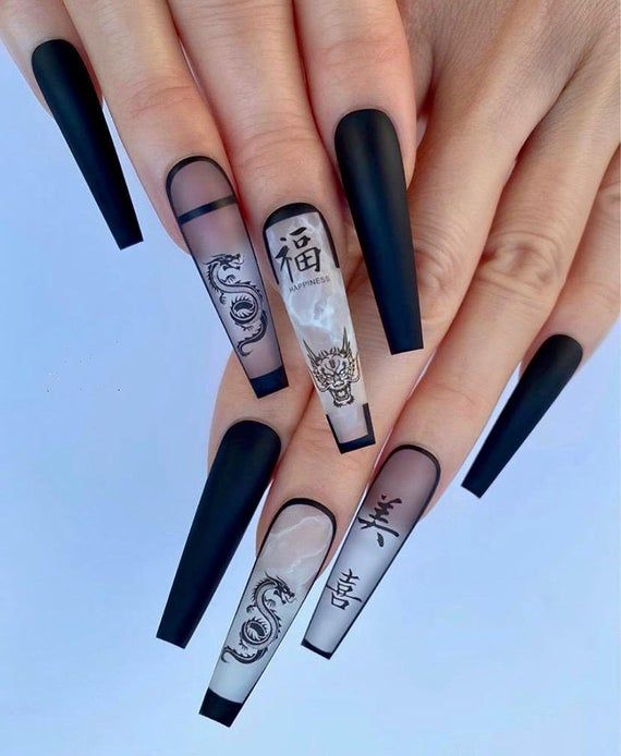In this image show, the log black and white combination color with the black dargon nails designs.