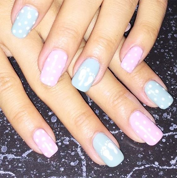 In this image show, the pink and blue color with polka dots nails design.