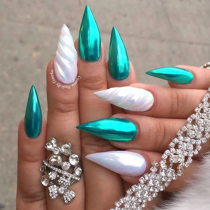 In this image show, the long green color with this white color mermaid's nails design.