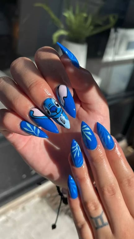 In this image show, the long blue color density nails design for mermaid's nails manicure.