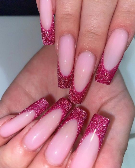In this image show, the long coffin pink color with this glitter dark pink nails design.