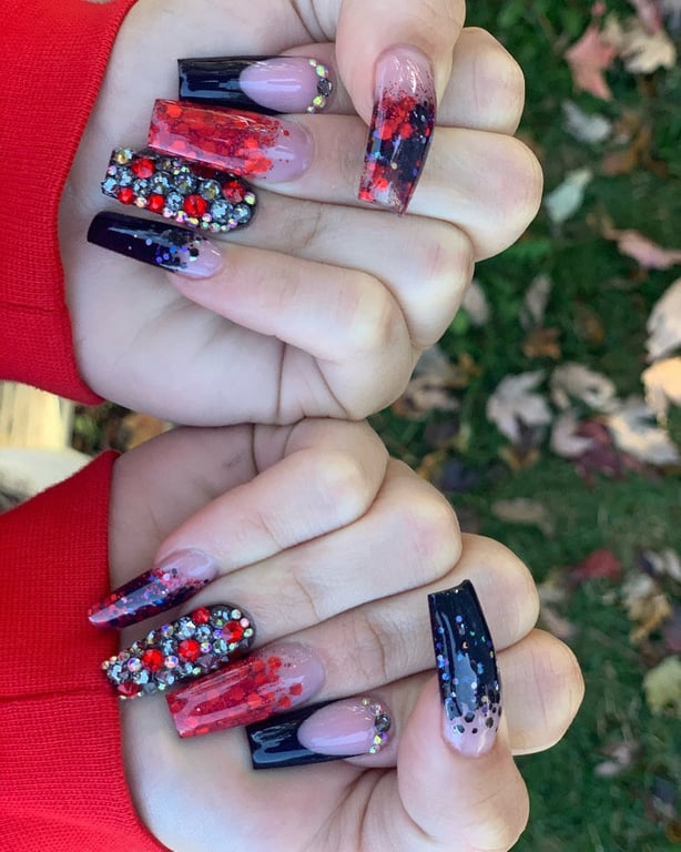In this image show, the black and red with glitter nails design for valentines nail.