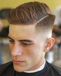 In this image show Comb Over Mid Fade Haircut