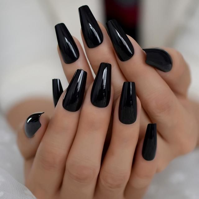 In this image show, the long dark classic black nails design.