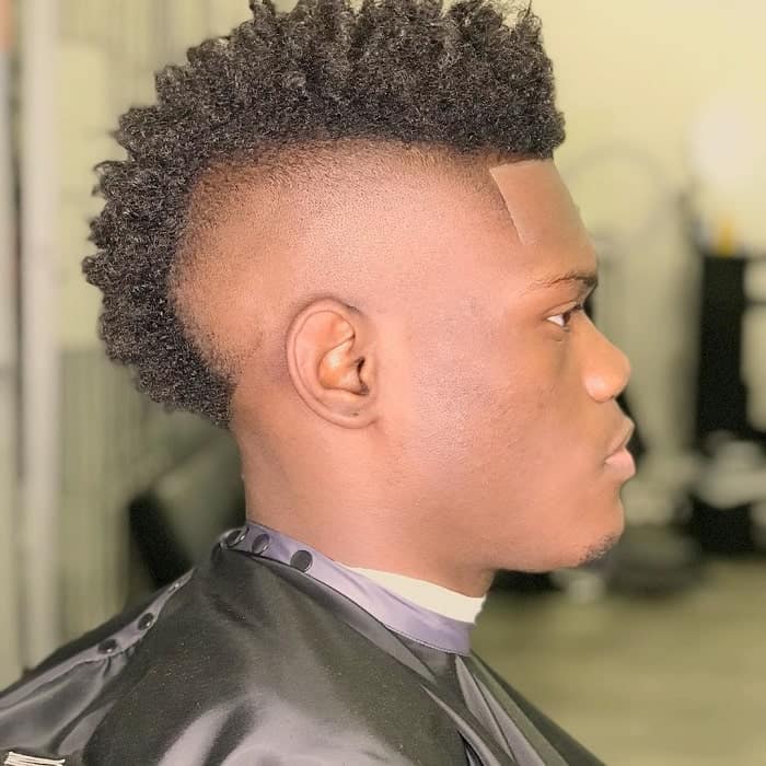 In this image show Black Men's Taper Haircut With Fohawk