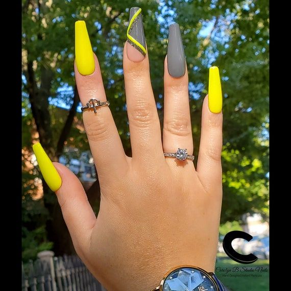 In this image show, the long gray and neon color nails design.