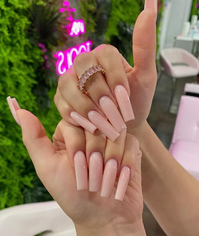 In this image show, the long nude color of nails design to look elegant and simple.