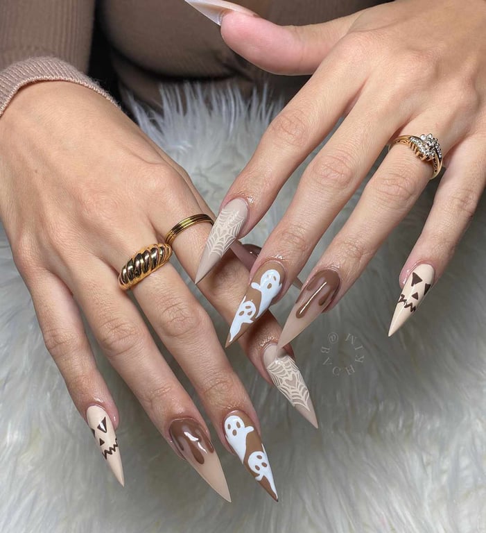 In this image show, peach and white color of nails design with the simp[le and cool with showing both hands pose of nails design.
