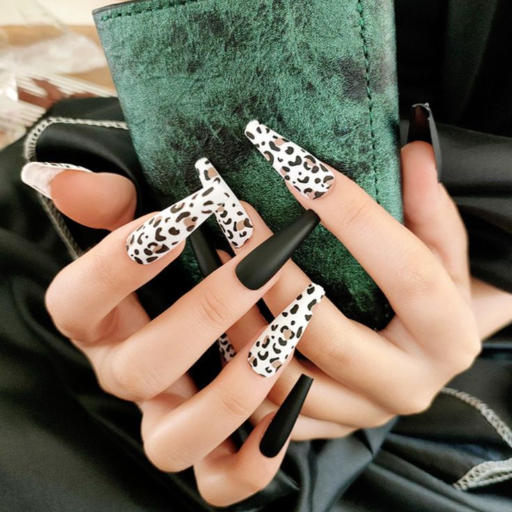 In this image show, the extra long black and white printed nails design.