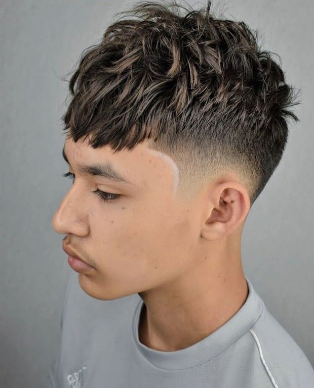 the image shows, Curly Fringe Edgar Haircut