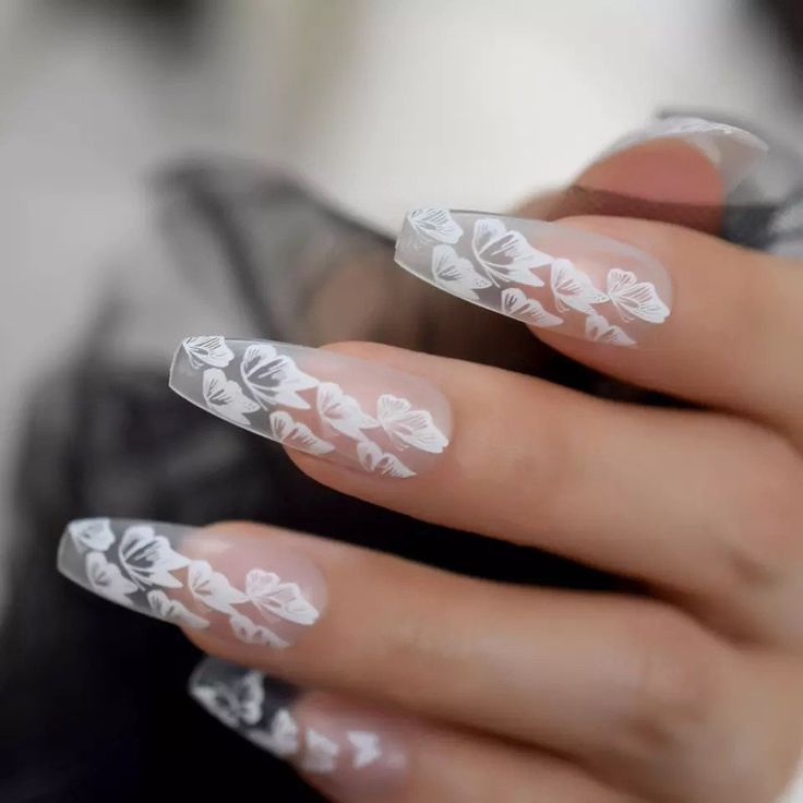 In this image show, the long coffin transparent nails design.