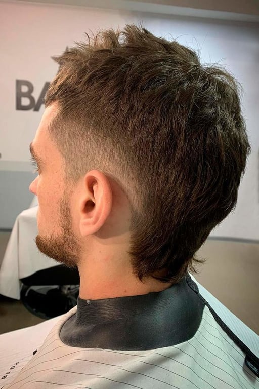 the image shows, taper fade mullet haircut