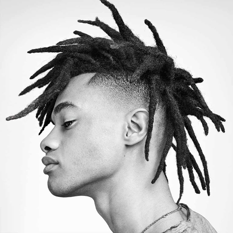 the image shows, burst fade mohawk dreads