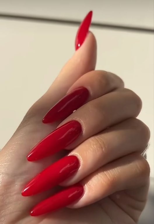In this image show, the long dark red color with the ombre nails shape design.