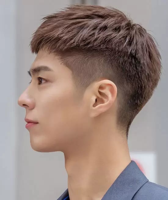 the image shows, Korean inspired high taper haircut