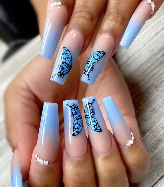 In this image show, the pink-blue color with butterfly nails design.
