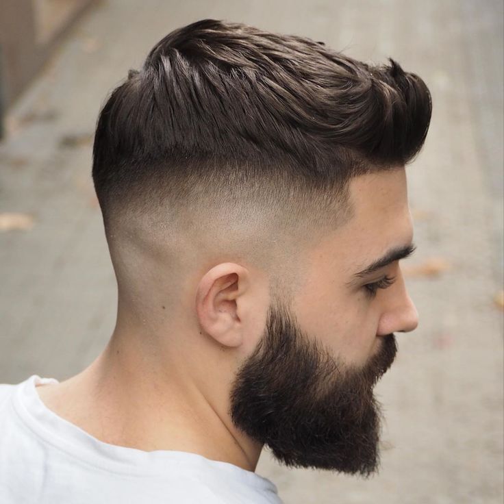 the image shows, quiff men's fade haircut