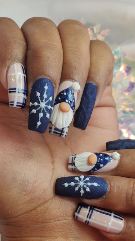 In this image show, the blue color snowflake nails design.