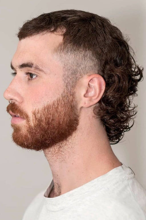 the image shows, Curly Mullet Edgar Haircut