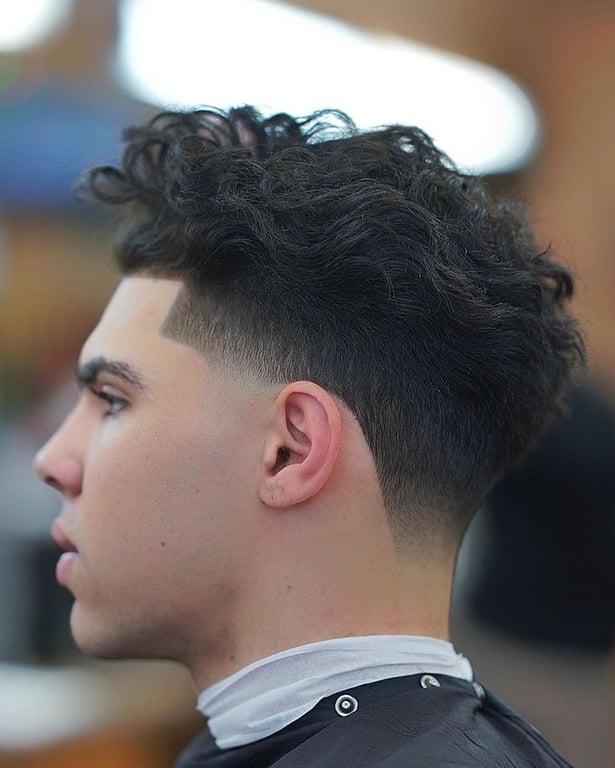 the image shows, haircut for men taper fade