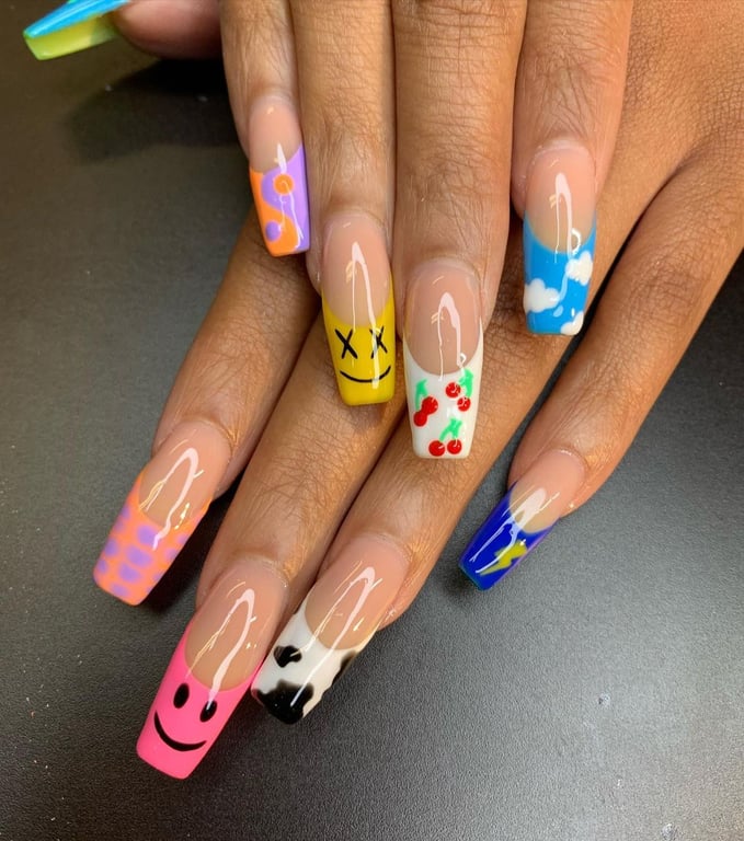 In this image show, the fun-loving vibrent yellow, orange,pink,and blue french tip nails design.
