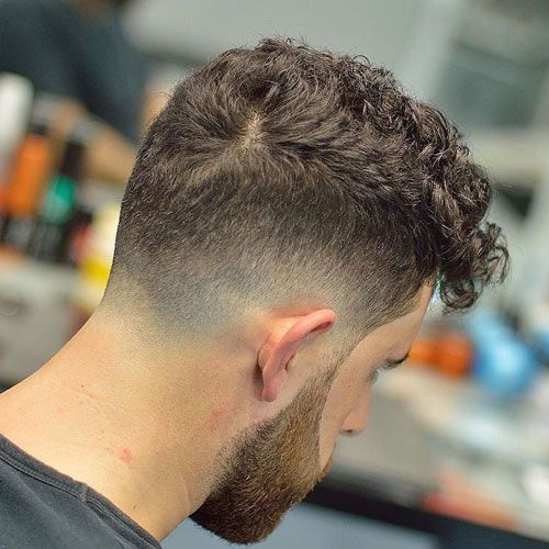 the image shows, Low Drop Fade Curly Hair