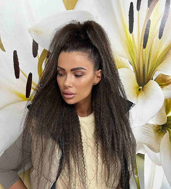 In this image show, the Crimped Medium Black Hair Ponytail