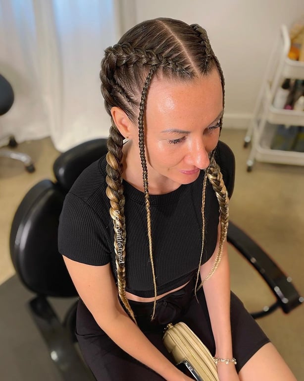 In this image show, the Two Cornrow Braids hairstyles.