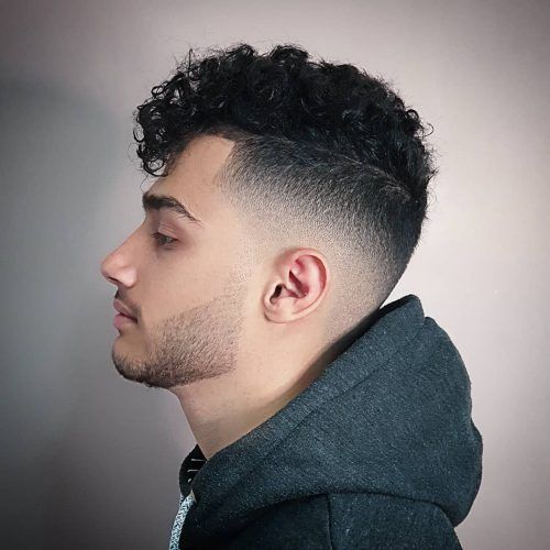 In this image show Curly Skin Fade Haircut