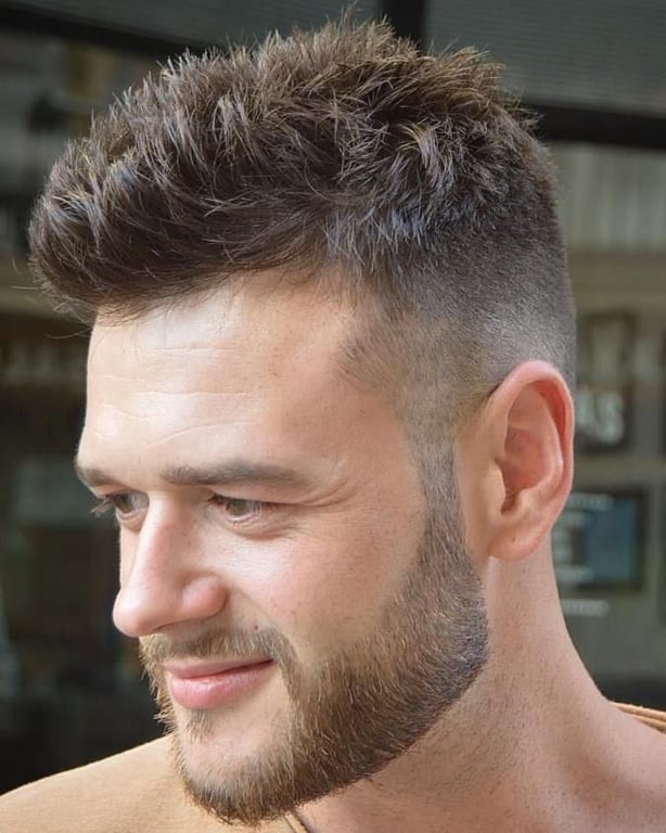 the image shows, short spiky fade haircut