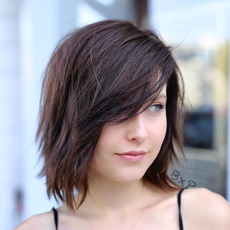 In this image show Wolf Cut With Side Swept Bangs 
