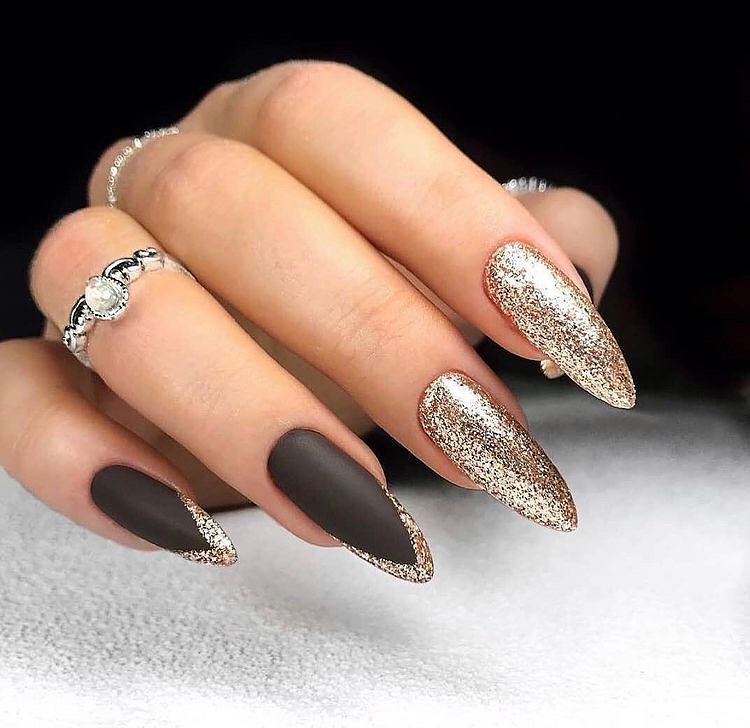 In this image show, the black and gold color nails design for valentines day.
