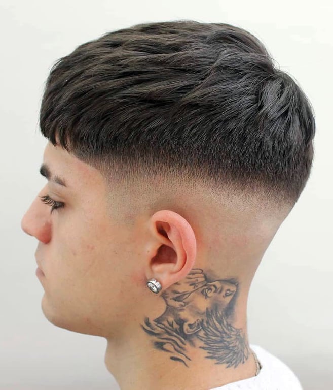 the image shows, low taper fade haircut edgar