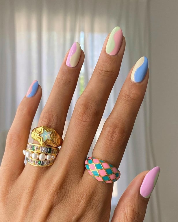 In this image show, the mid-length of pastel color of nails design.