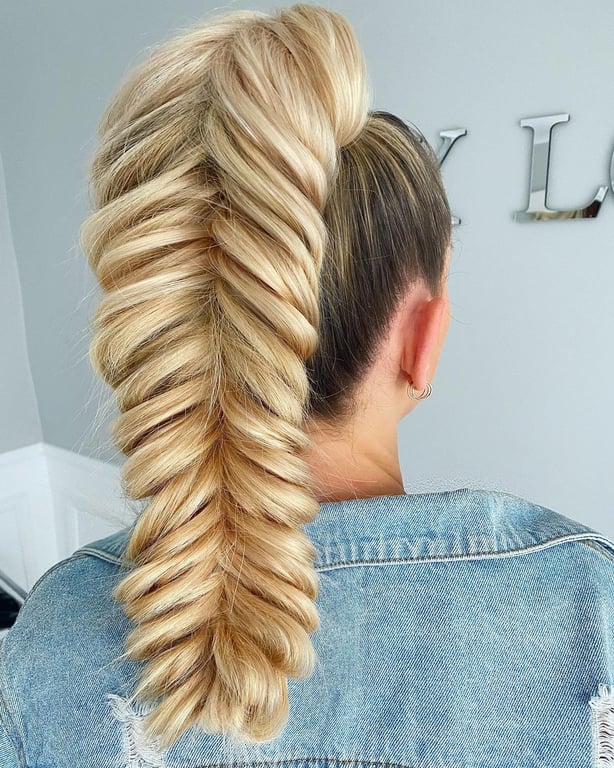 In this image show, the long blonde hair with this beautiful  Fishtail Braid hairstyle.
