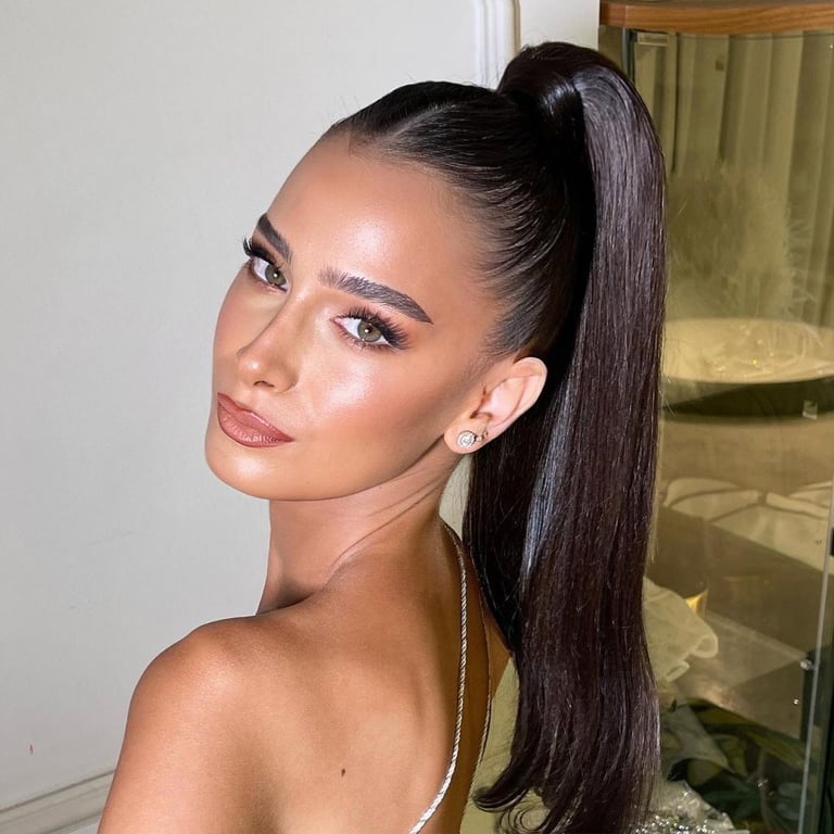 In this image show, the Sleek Side Part Ponytail