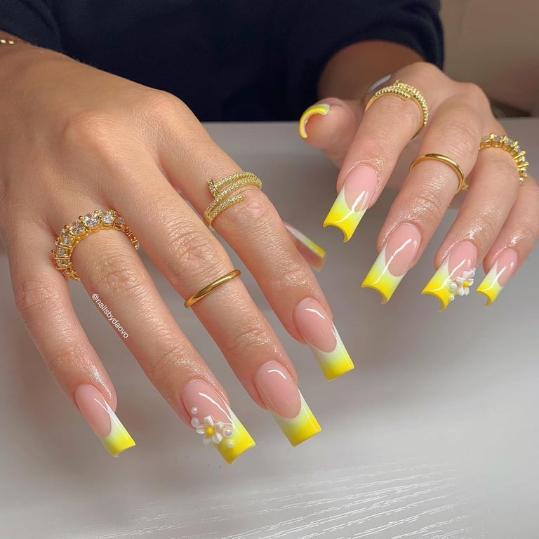 In this image show, the yellow color french tip nails design.