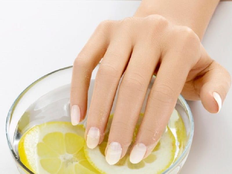 the image shows, hands dipped in lemon juice