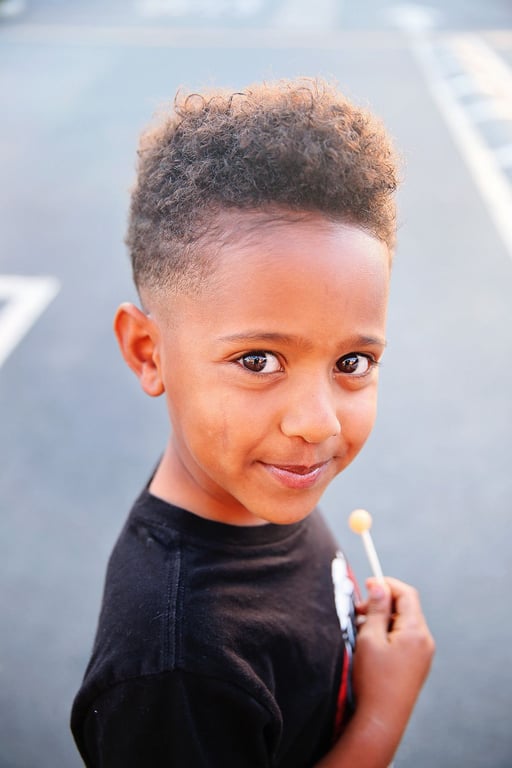 In this image show Low Fade Haircut Black Boy