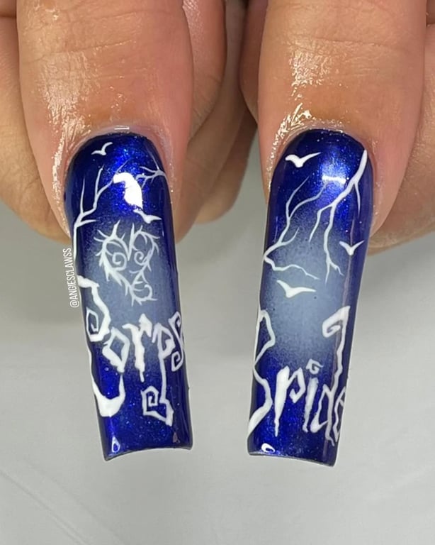 In this image show, the blue color listing holloween nails design