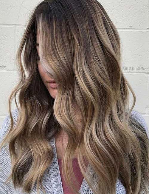 the image shows, ombre on long shag haircut