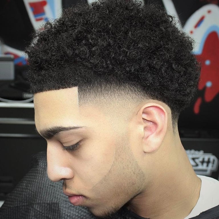 the image shows, mid taper fade haircut