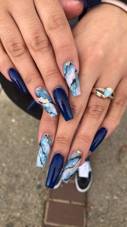 In this image show, the long Marble Nails nails designs in dark blue color which look an amazing.