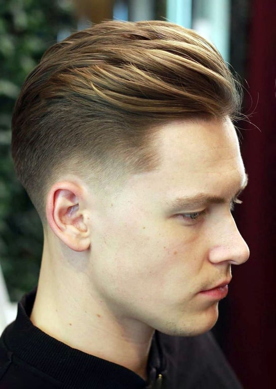 the image shows, mid taper haircut long hair