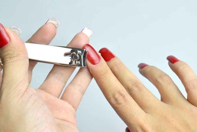 the image shows, cutting of the acrylic nails